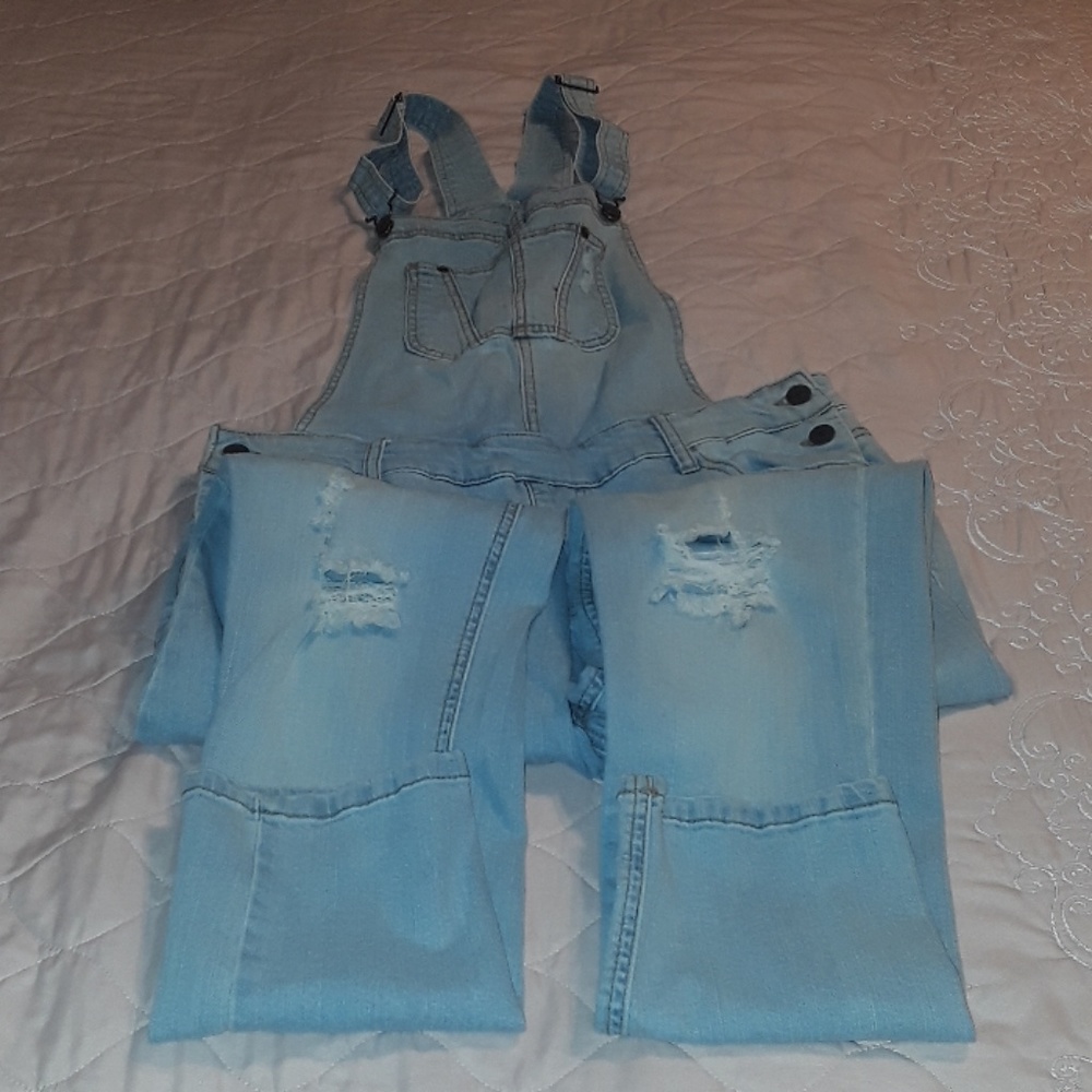 Whitewashed denim overalls.
